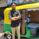 Javed Khan standing next to his auto which he converted into a mini ambulance.
